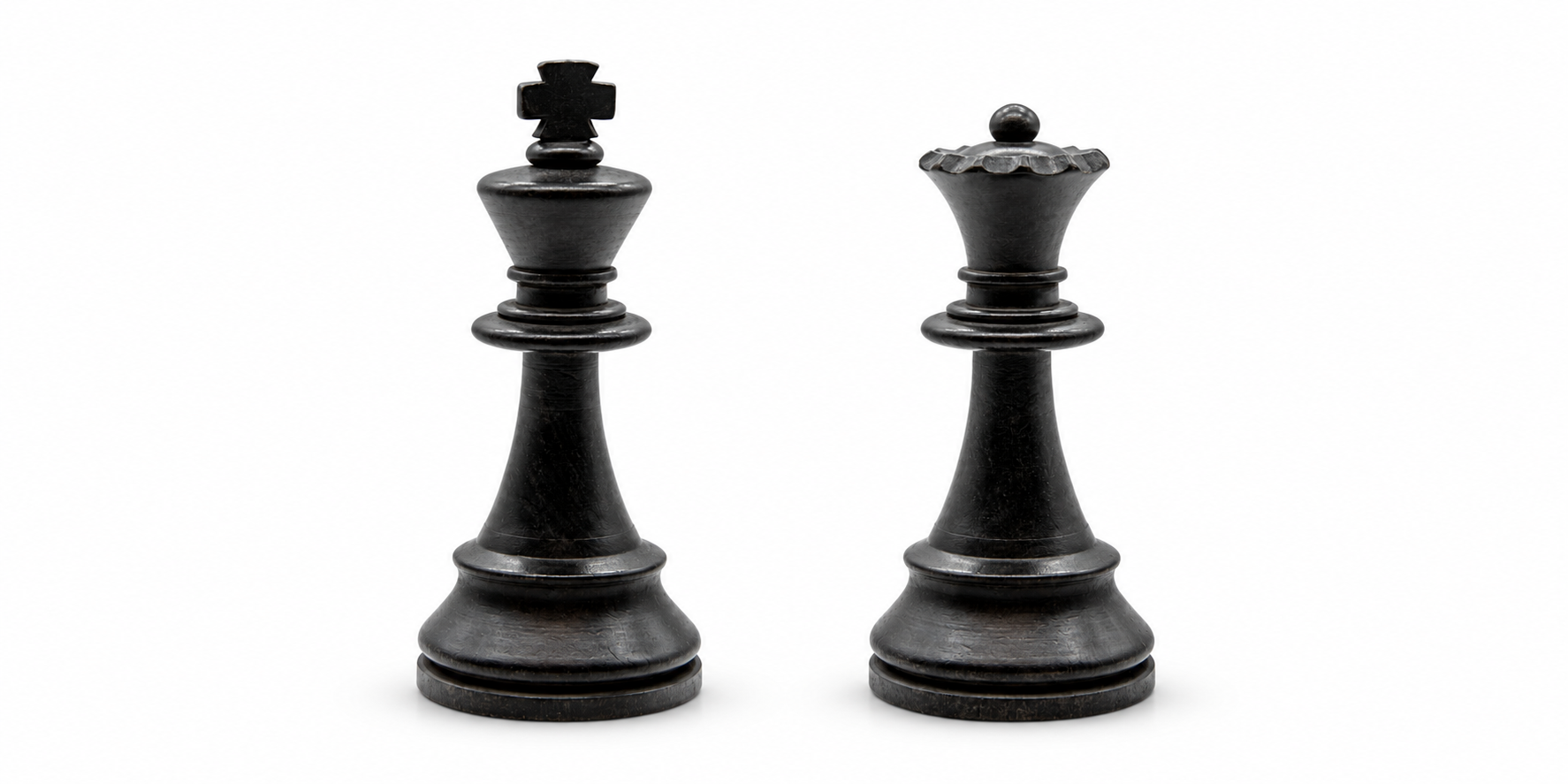 Black King and Queen chess pieces against a white background, illustrating the need for marketing leadership and direction.
